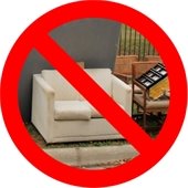 Red circle slash over junky furniture