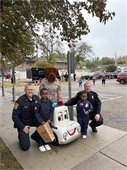 photo of officers with children at Coptober event