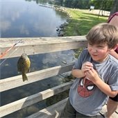 photo of boy fishing